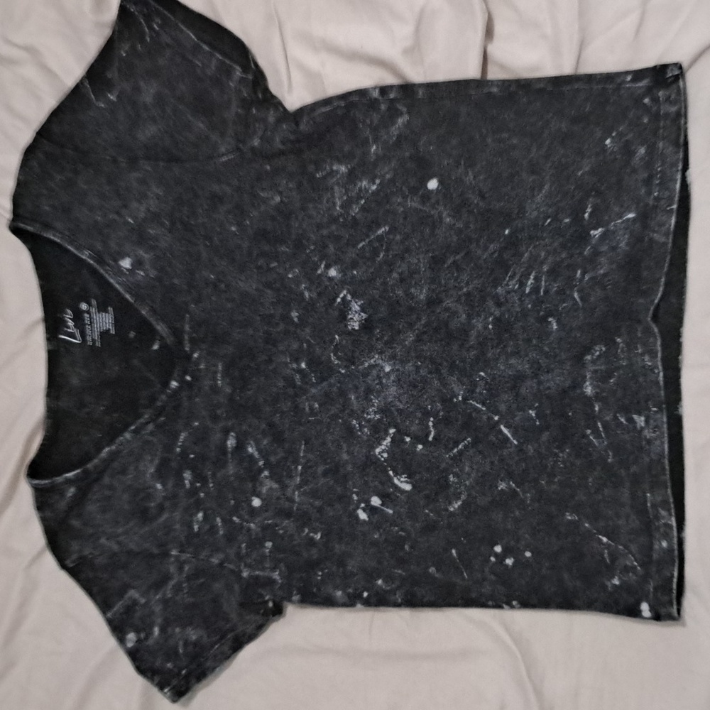 It's a tight fitting shirt from livie, it's a medium and it's black and white.
